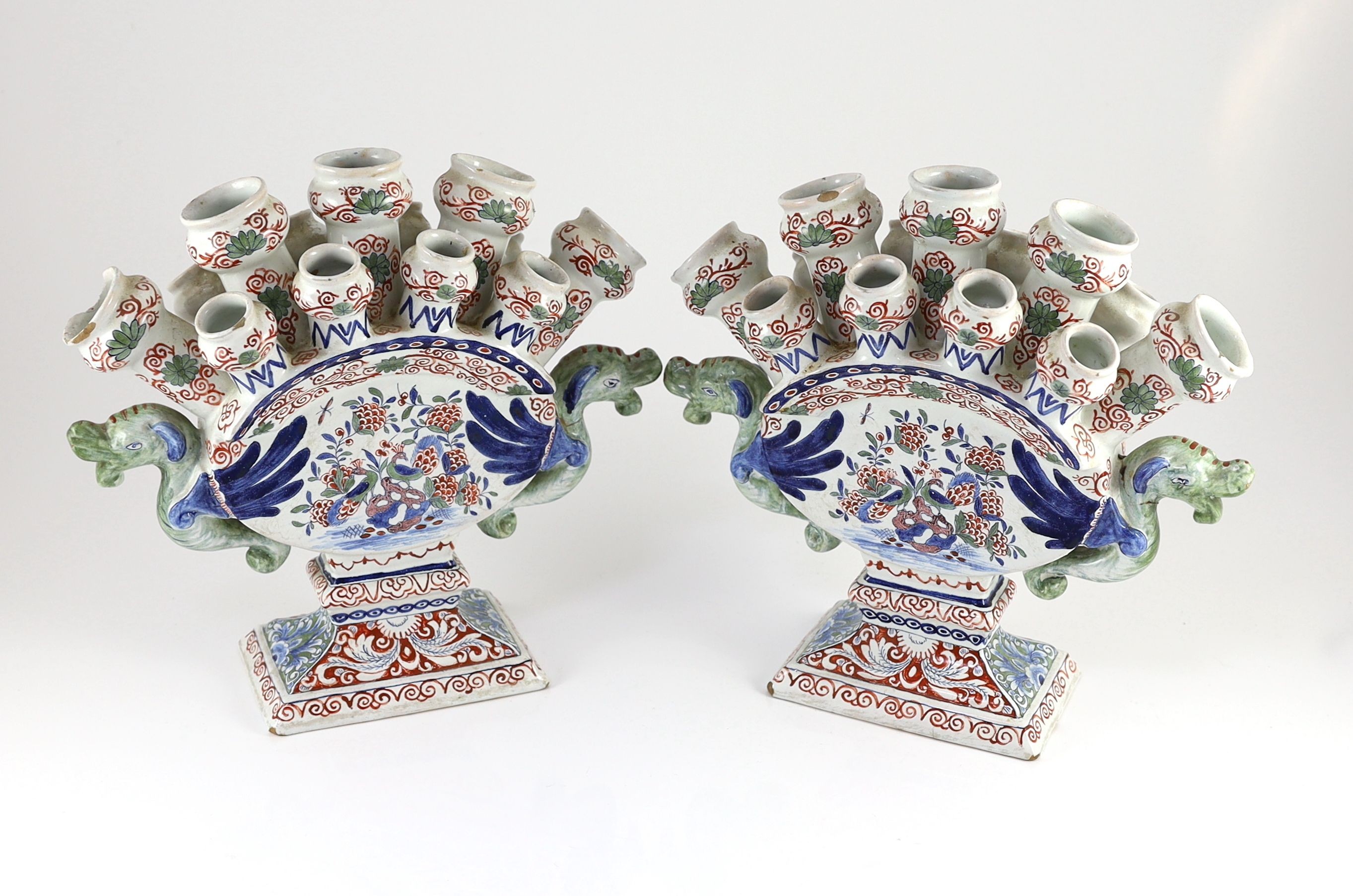 A pair of Delft polychrome multiple tulip vases, Lambertus van Eenhoorn, De Metaale Pot factory, c.1700-1720, 30cm high, 32cm wide